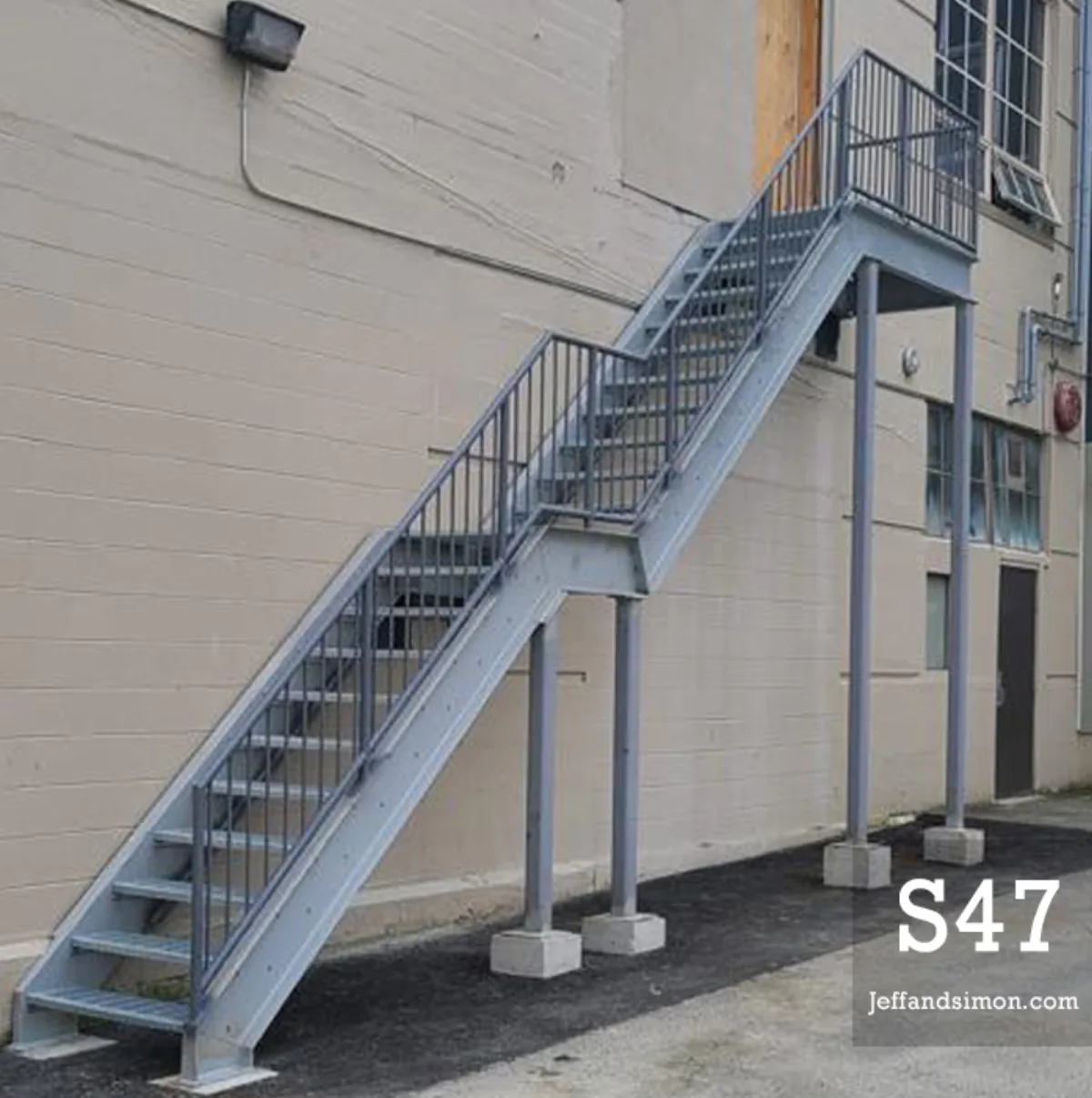 Fabricated steel structure with welded members and industrial finish