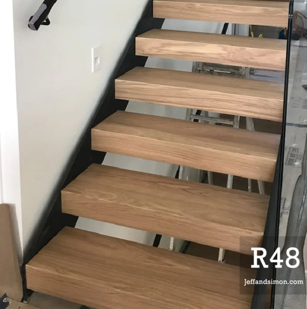 Custom mono stringer staircase with oak treads and glass railing, Vancouver Stairs residential project